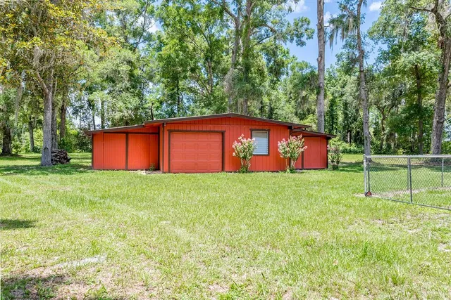 a view of yard with swimming pool