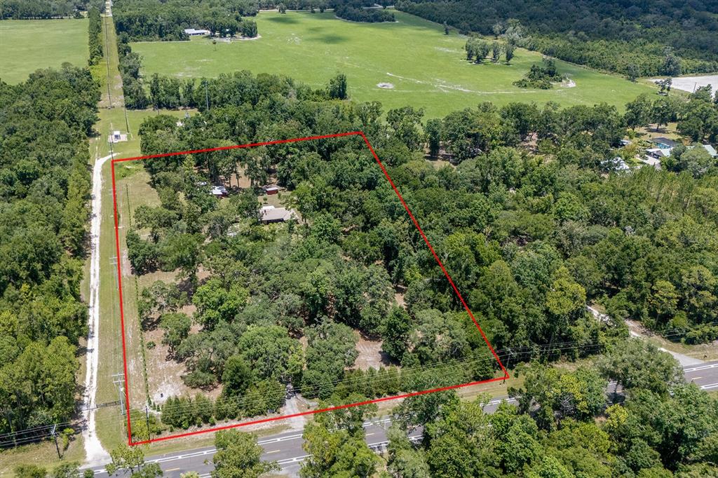 8991 Northwest 115th Street Chiefland, FL 32626 - Photo 20 of 49 a view of a garden with a building