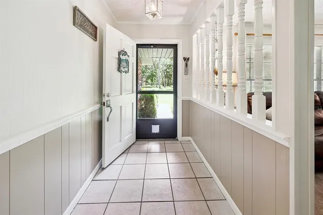 a living room with furniture ceiling fan and a fireplace