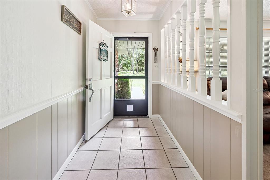 8991 Northwest 115th Street Chiefland, FL 32626 - Photo 25 of 49 a view of a hallway with windows