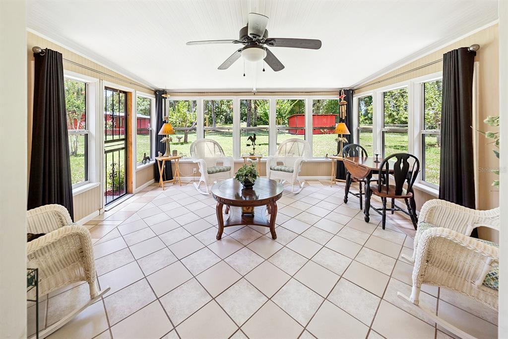 8991 Northwest 115th Street Chiefland, FL 32626 - Photo 37 of 49 a living room with furniture and a large window