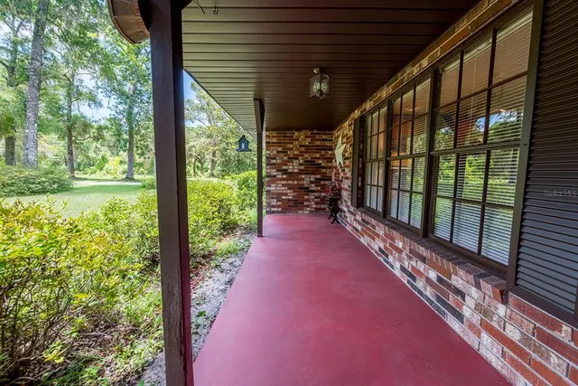 a backyard of a house with outdoor seating