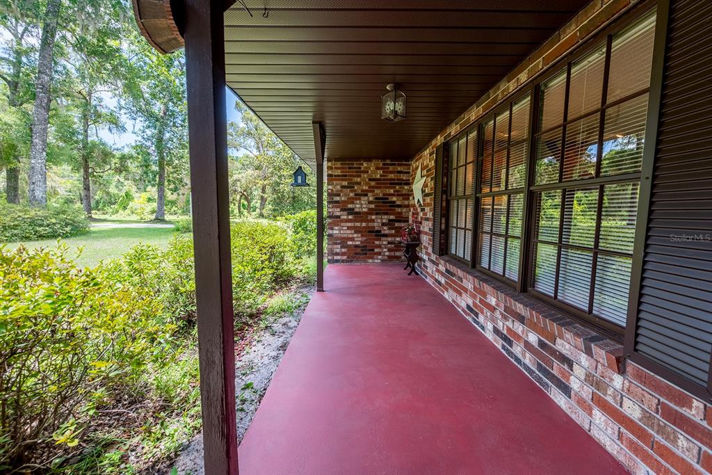 8991 Northwest 115th Street Chiefland, FL 32626 - Photo 6 of 49 a view of a porch