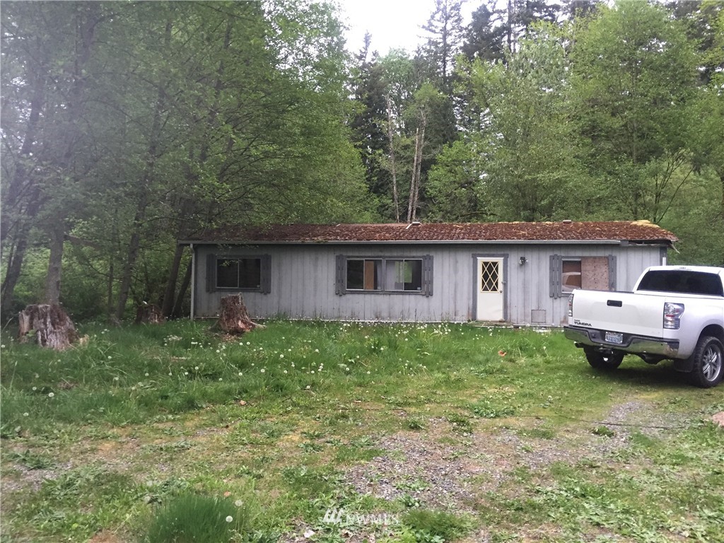 22410 Sweeney Road Southeast Maple Valley, WA 98038 - Photo 2 of 4 a view of a house with backyard