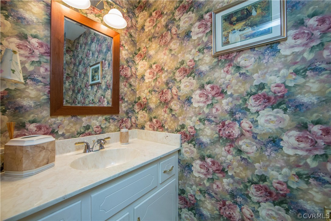 13639 Solstice Cl Midlothian, VA 23113 - Photo 20 of 46 a bathroom with a sink and a mirror