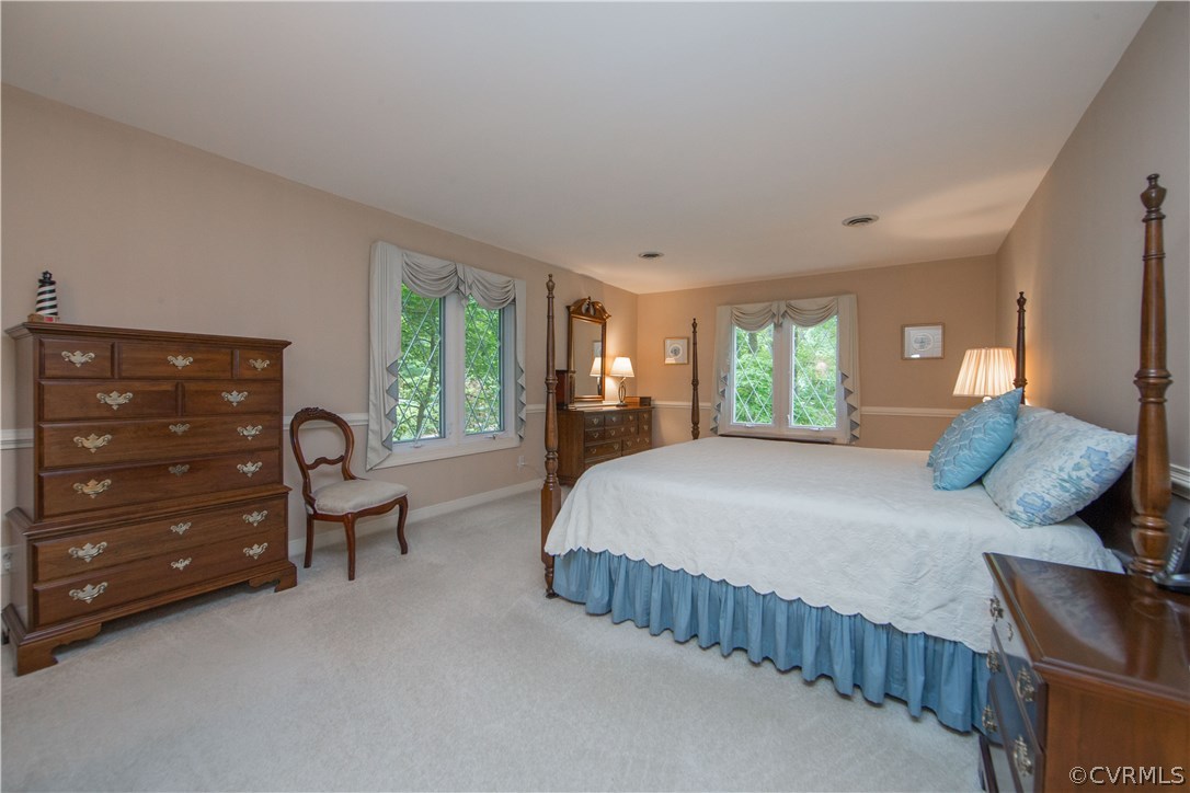 13639 Solstice Cl Midlothian, VA 23113 - Photo 21 of 46 a bedroom with a bed and dresser with mirror