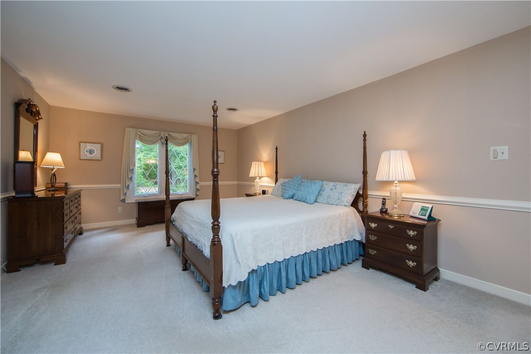 13639 Solstice Cl Midlothian, VA 23113 - Photo 22 of 46 a bedroom with a bed and a lamp