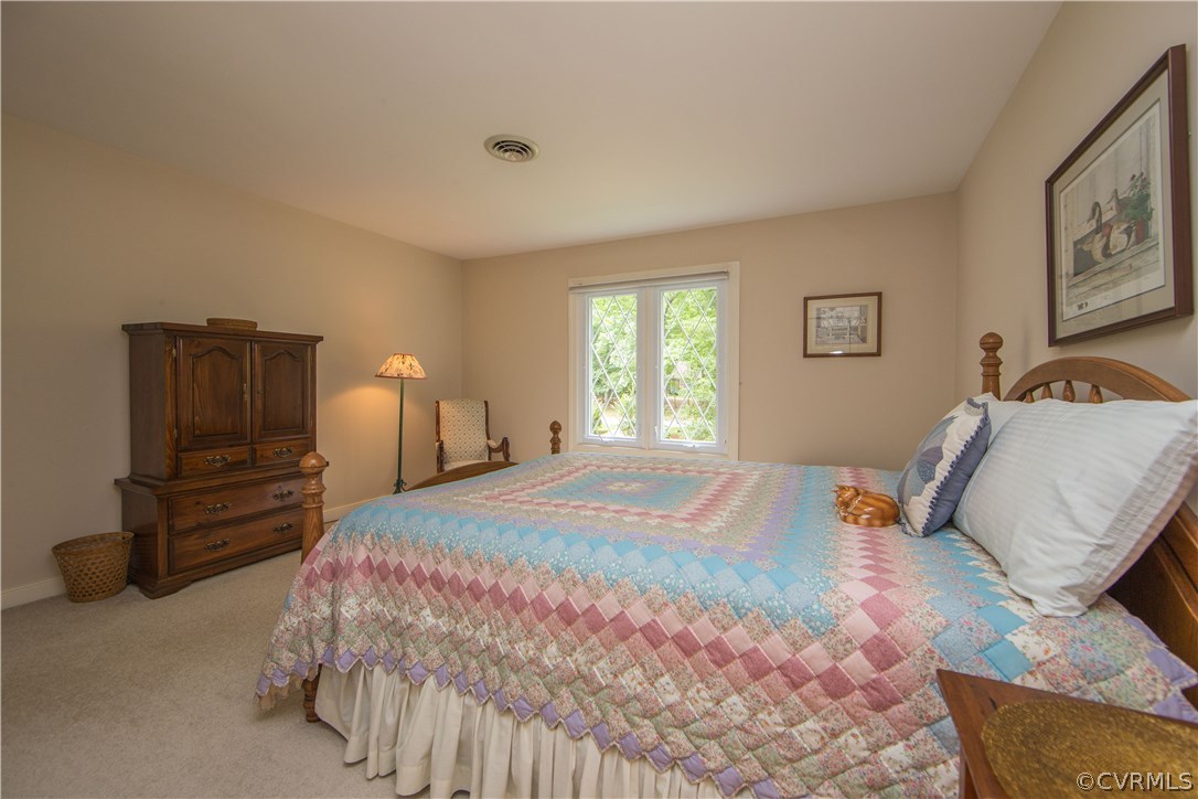 13639 Solstice Cl Midlothian, VA 23113 - Photo 32 of 46 a bedroom with a bed and wooden floor