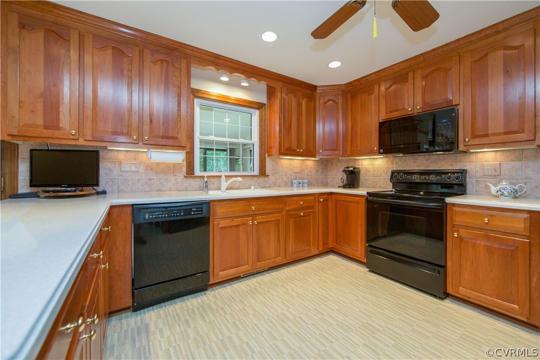 13639 Solstice Cl Midlothian, VA 23113 - Photo 8 of 46 a kitchen with granite countertop wooden cabinets a stove top oven and stainless steel appliances