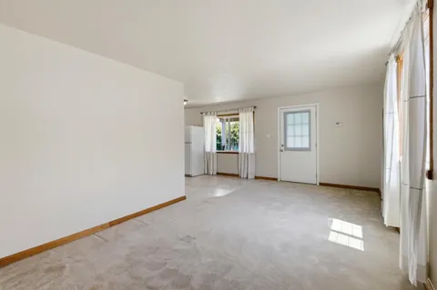an empty room with windows and lots of windows