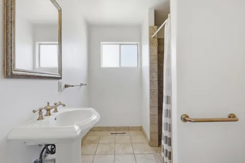 a bathroom with a sink and shower