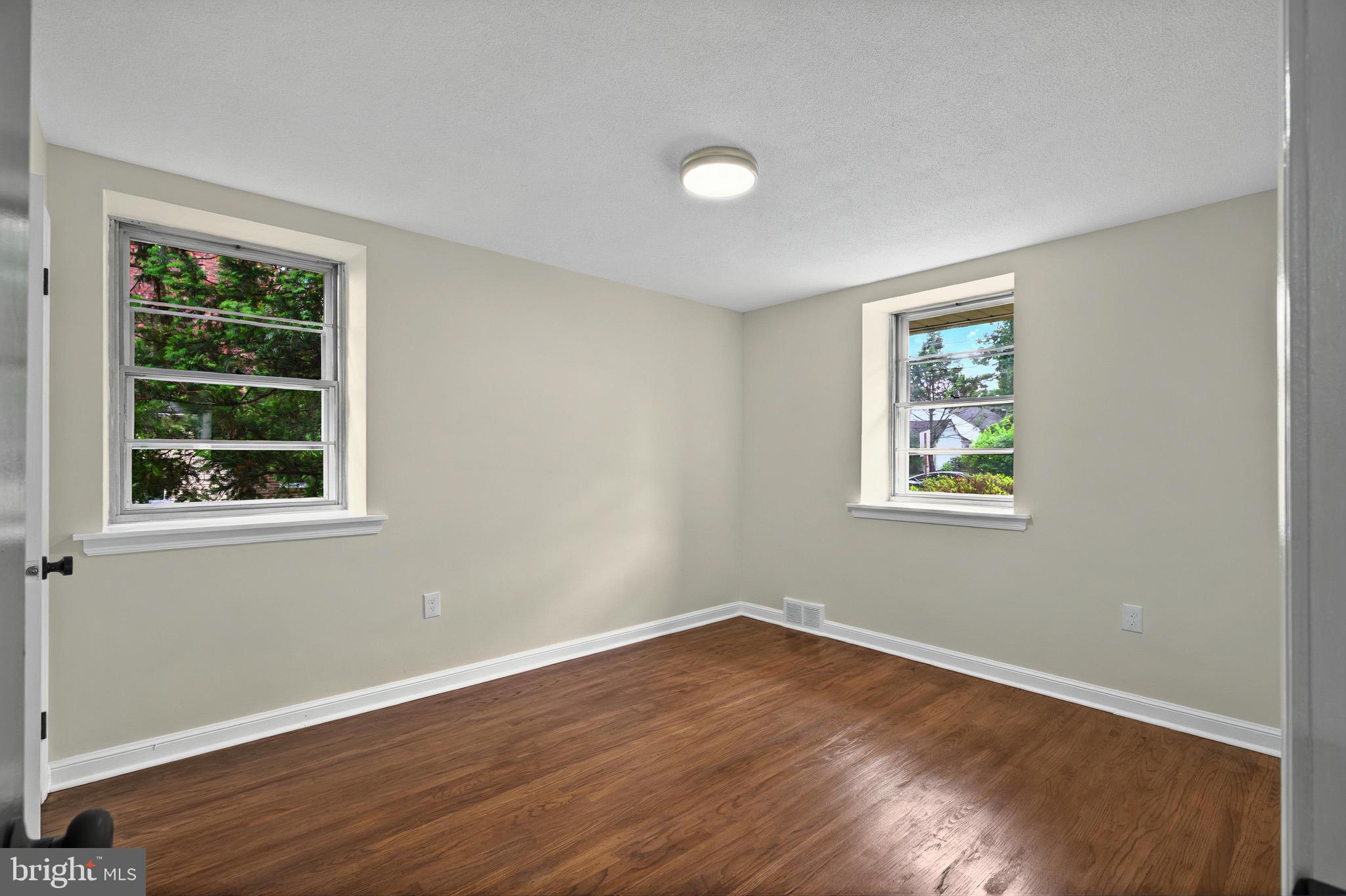 3 Arbor Lea Road Lansdowne, PA 19050 - Photo 14 of 32 wooden floor in an empty room with a window