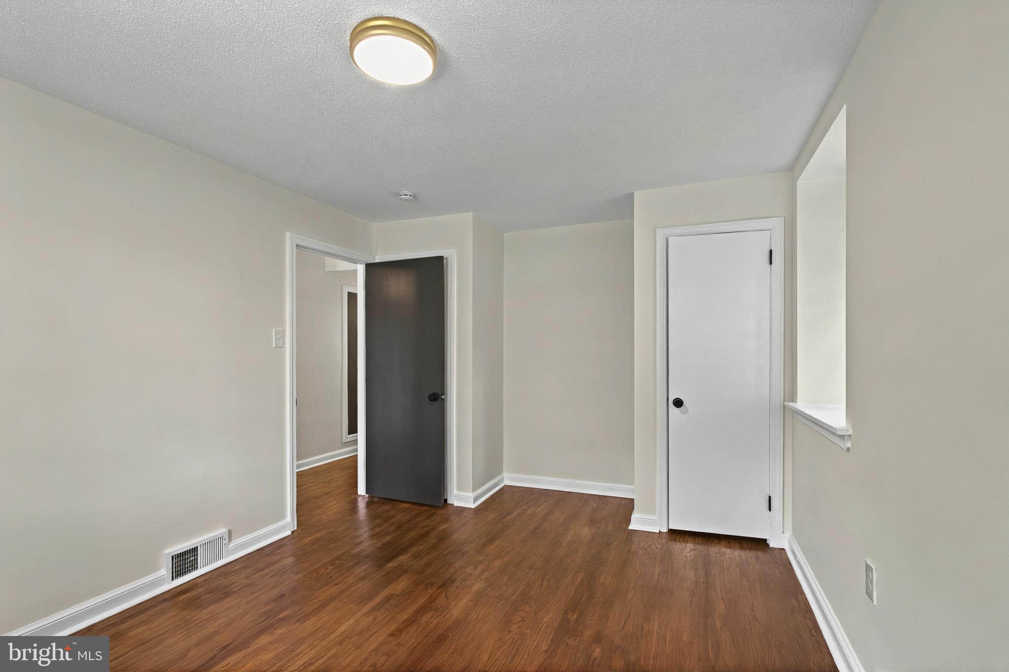 3 Arbor Lea Road Lansdowne, PA 19050 - Photo 15 of 32 an empty room with wooden floor and natural light