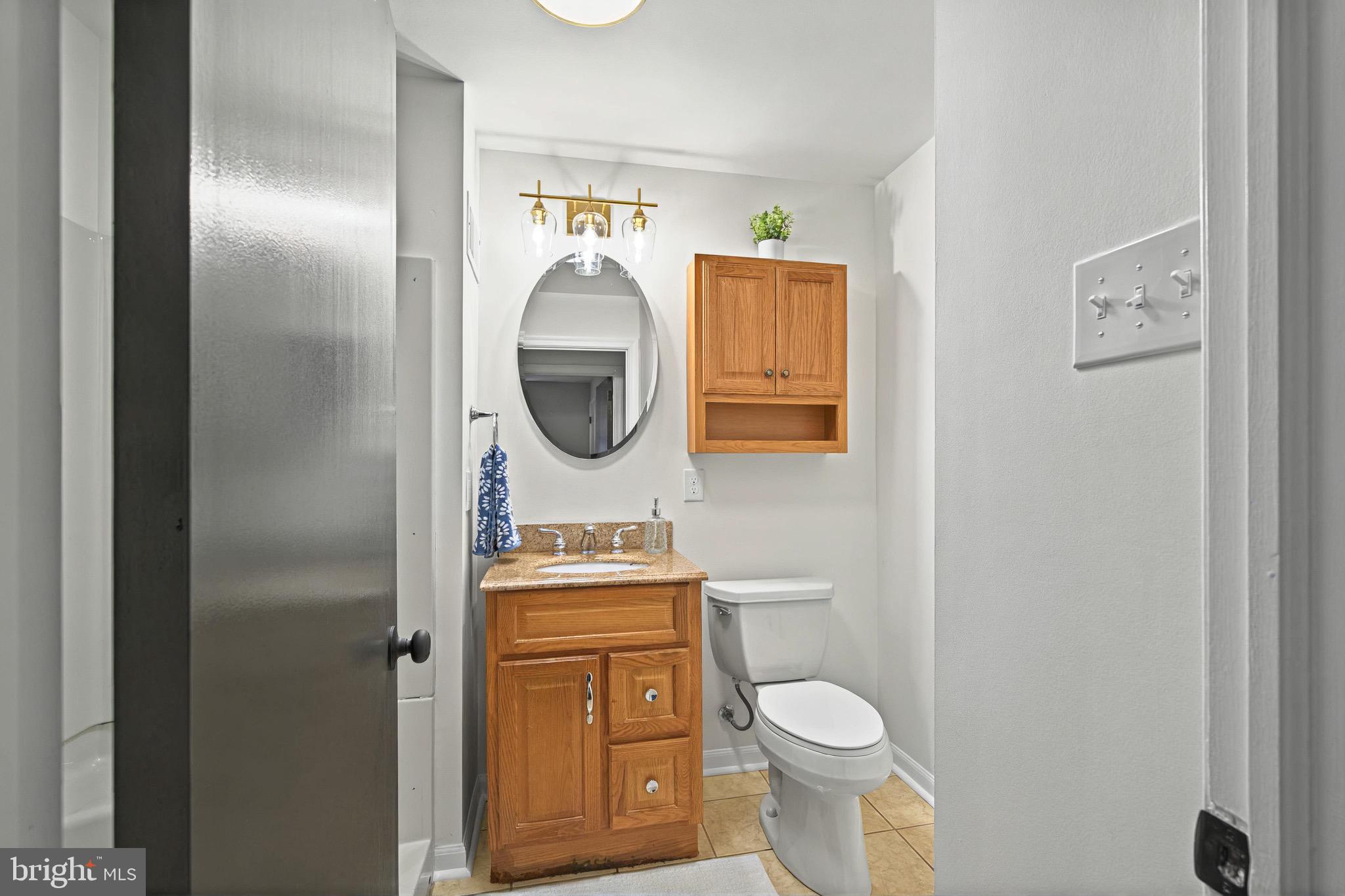 3 Arbor Lea Road Lansdowne, PA 19050 - Photo 16 of 32 a bathroom with a toilet sink and mirror