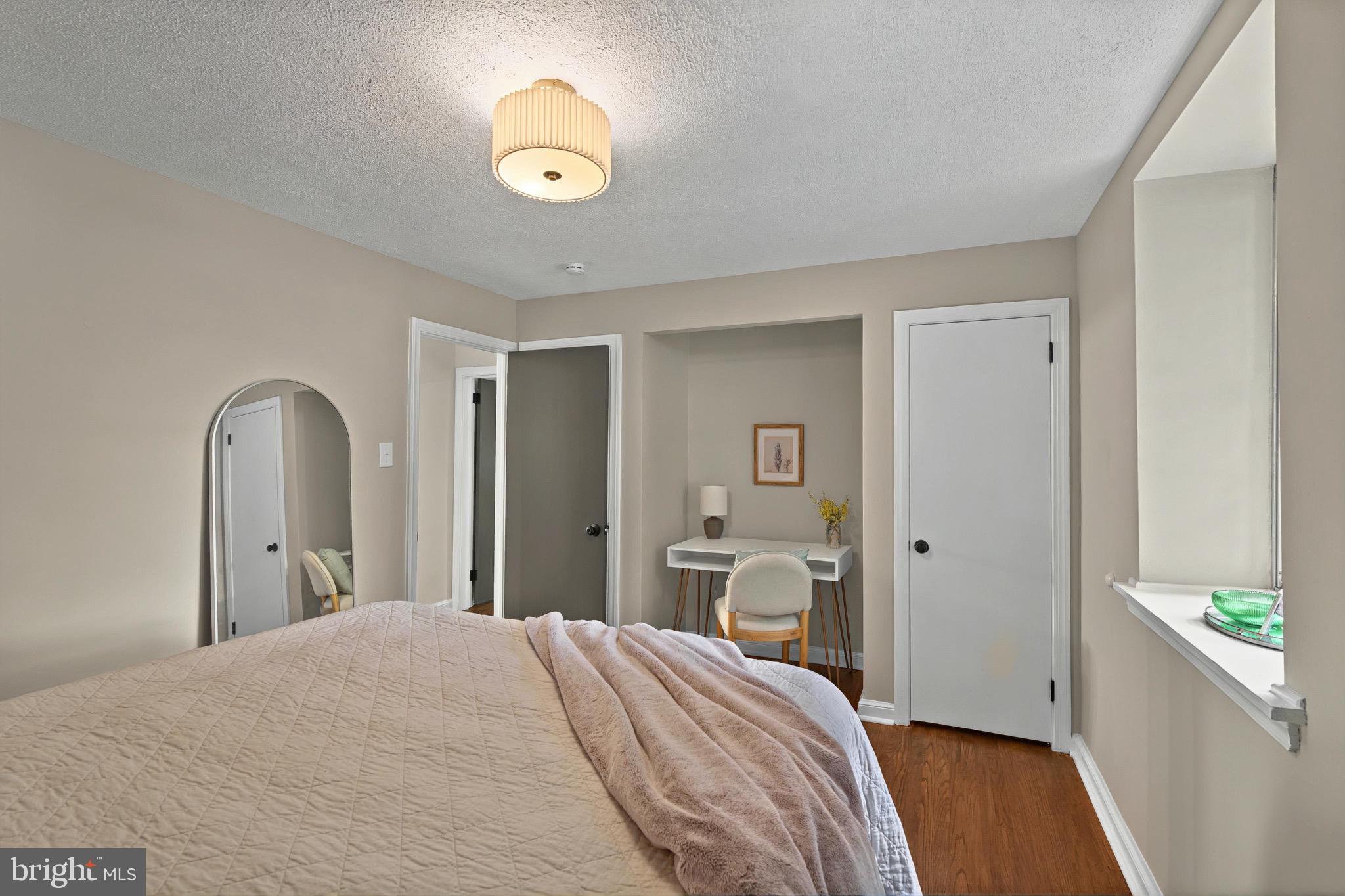 3 Arbor Lea Road Lansdowne, PA 19050 - Photo 19 of 32 a bedroom with a bed and a chandelier