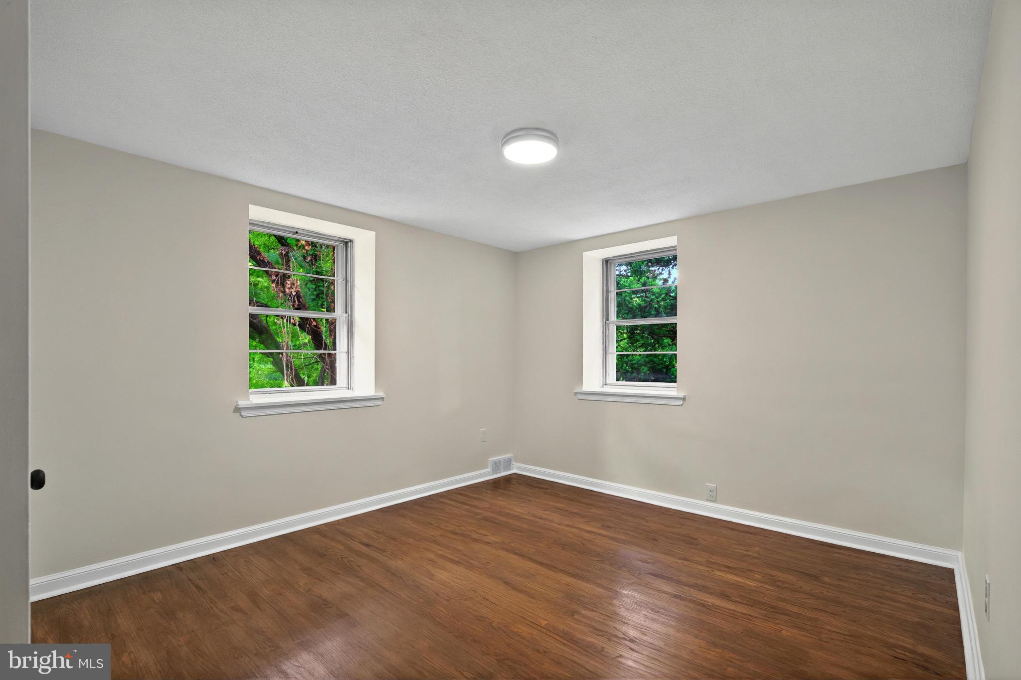 3 Arbor Lea Road Lansdowne, PA 19050 - Photo 20 of 32 a view of an empty room with wooden floor and a window
