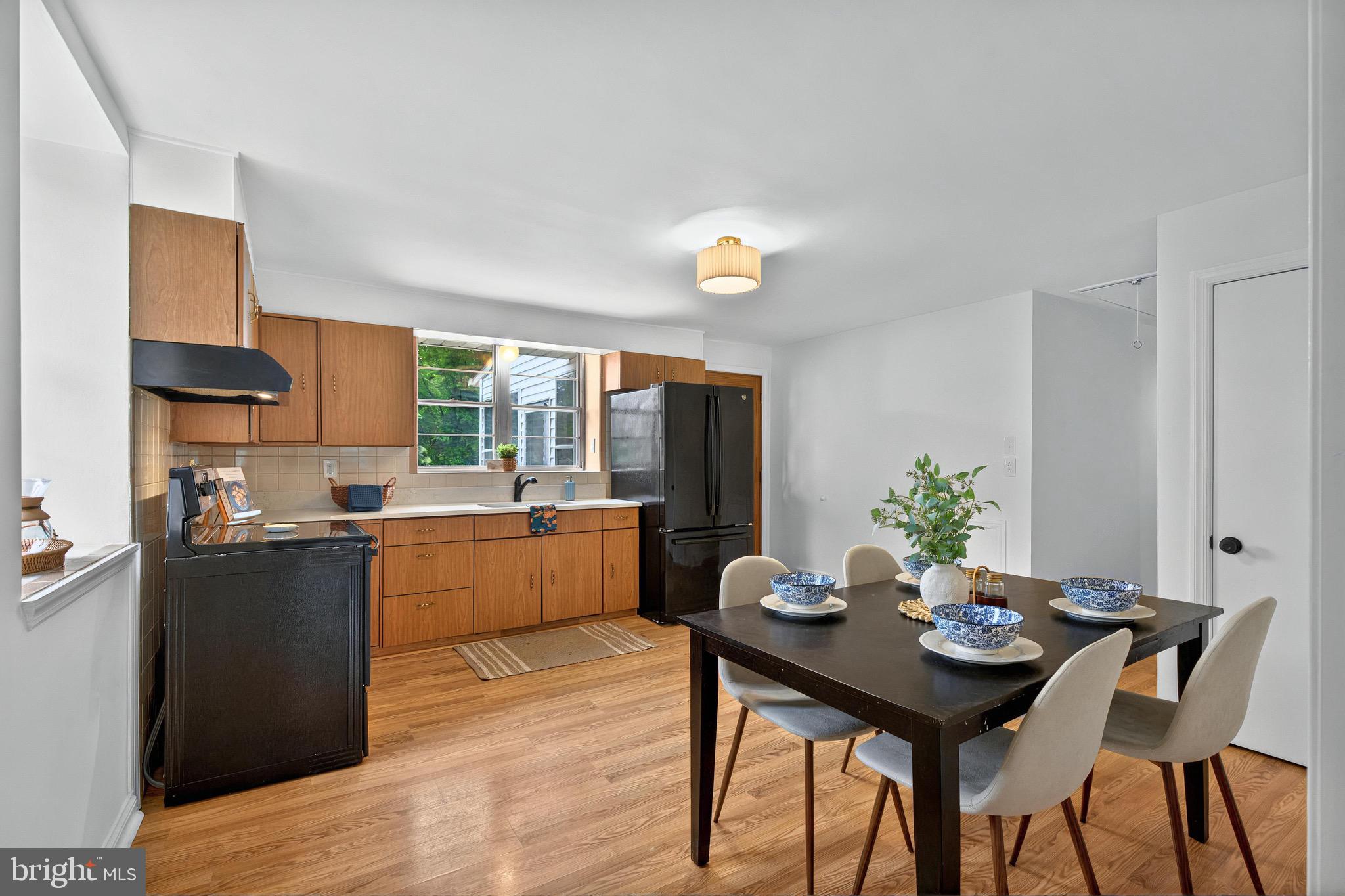 3 Arbor Lea Road Lansdowne, PA 19050 - Photo 9 of 32 a kitchen with a table and chairs in it