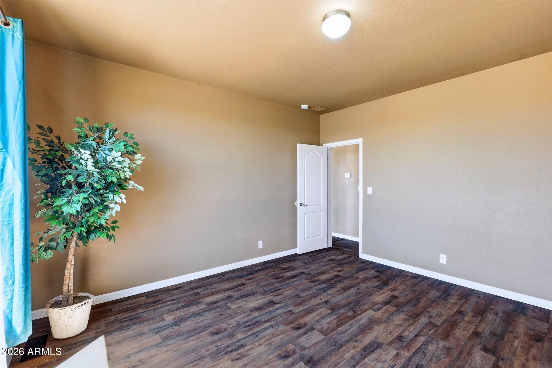 3216 North Mesquite Road Cochise, AZ 85606 - Photo 22 of 39 a view of an empty room with a potted plant