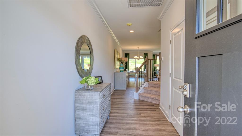 82 Creekview Road Hendersonville, NC 28792 - Photo 3 of 37 wooden floor in a gallery with a mirror