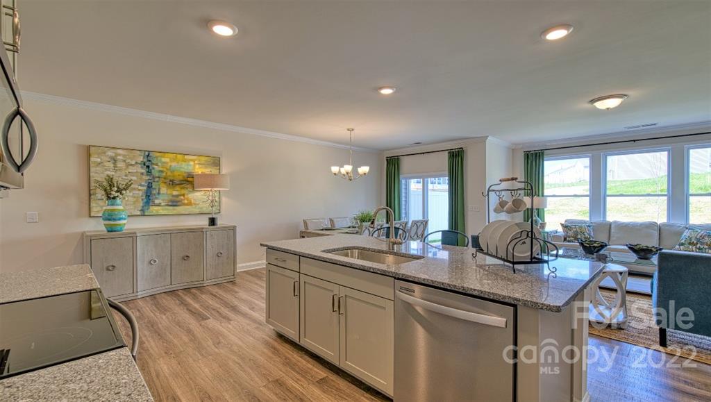 82 Creekview Road Hendersonville, NC 28792 - Photo 8 of 37 a kitchen with sink stove and wooden floor