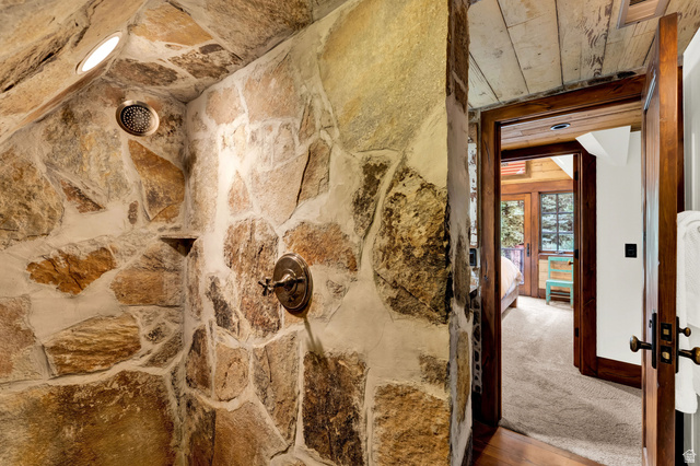 2983 East Ridgetop Road, Unit 27 Provo, UT 84604 - Photo 33 of 63 Rustic stone accent wall featuring natural earth-toned masonry with bronze hardware fixtures