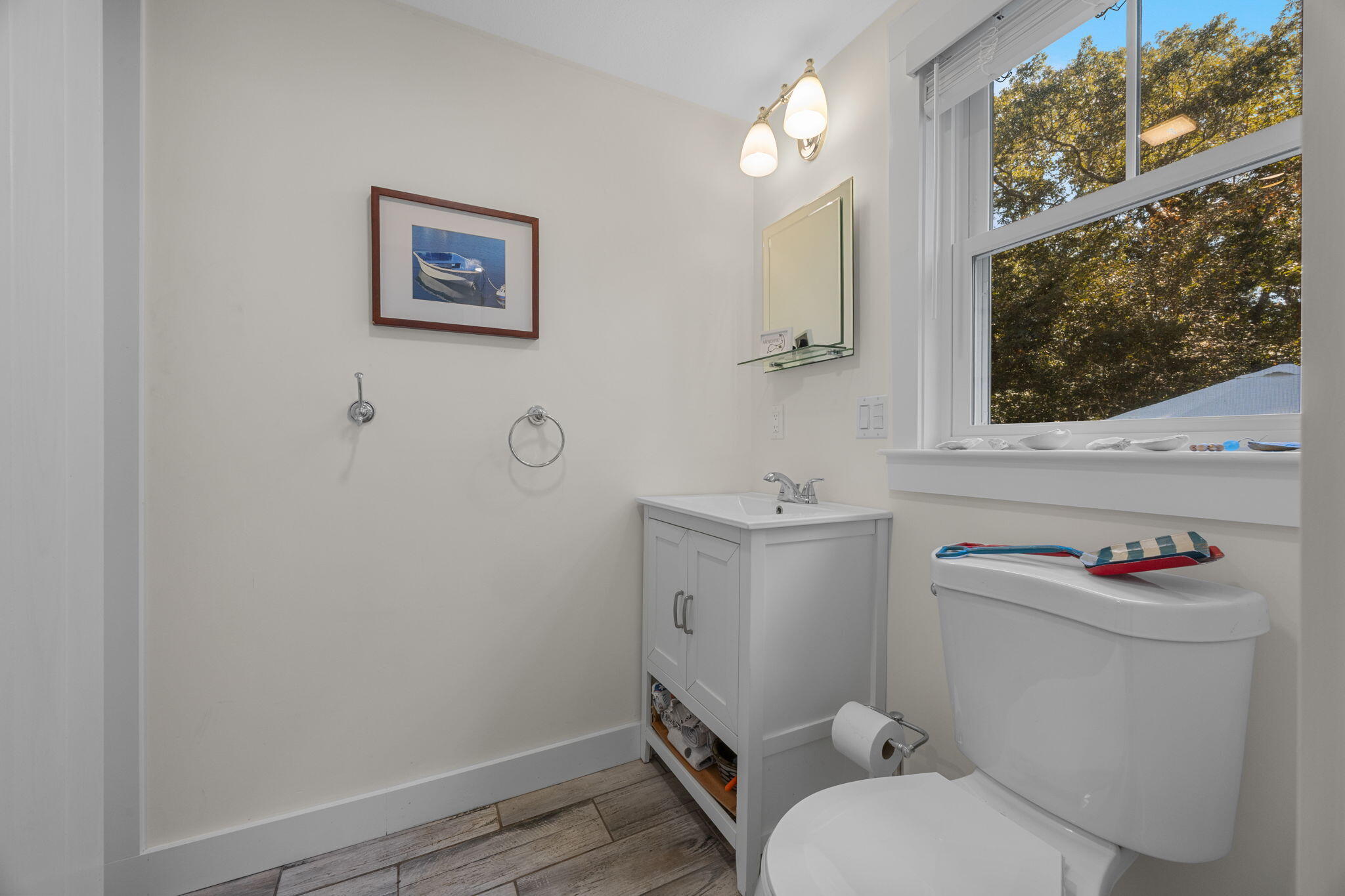 25 Robbins Road Harwich, MA 02646 - Photo 11 of 33 a bathroom with a toilet sink and mirror