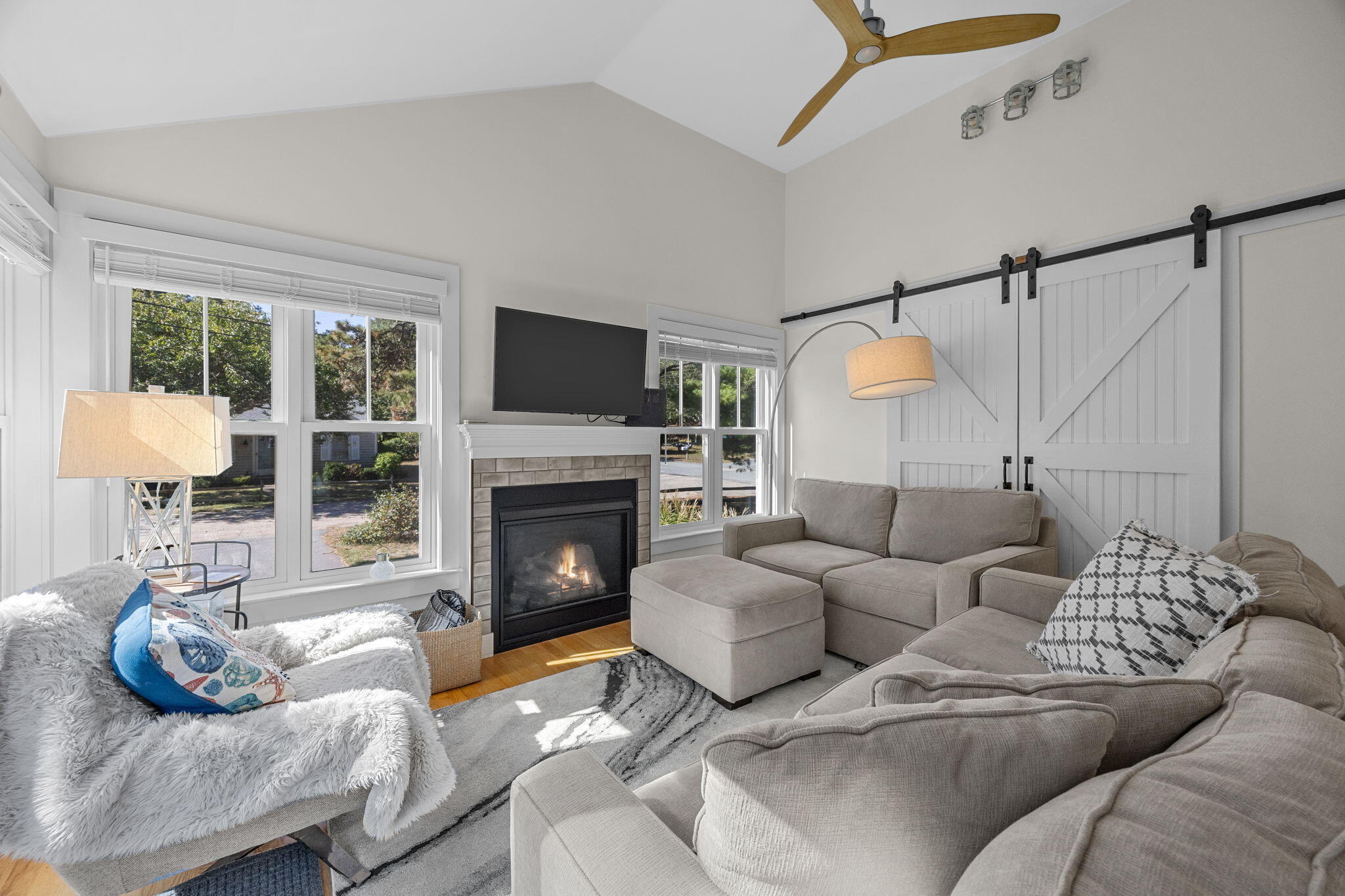 25 Robbins Road Harwich, MA 02646 - Photo 13 of 33 a living room with furniture and a fireplace