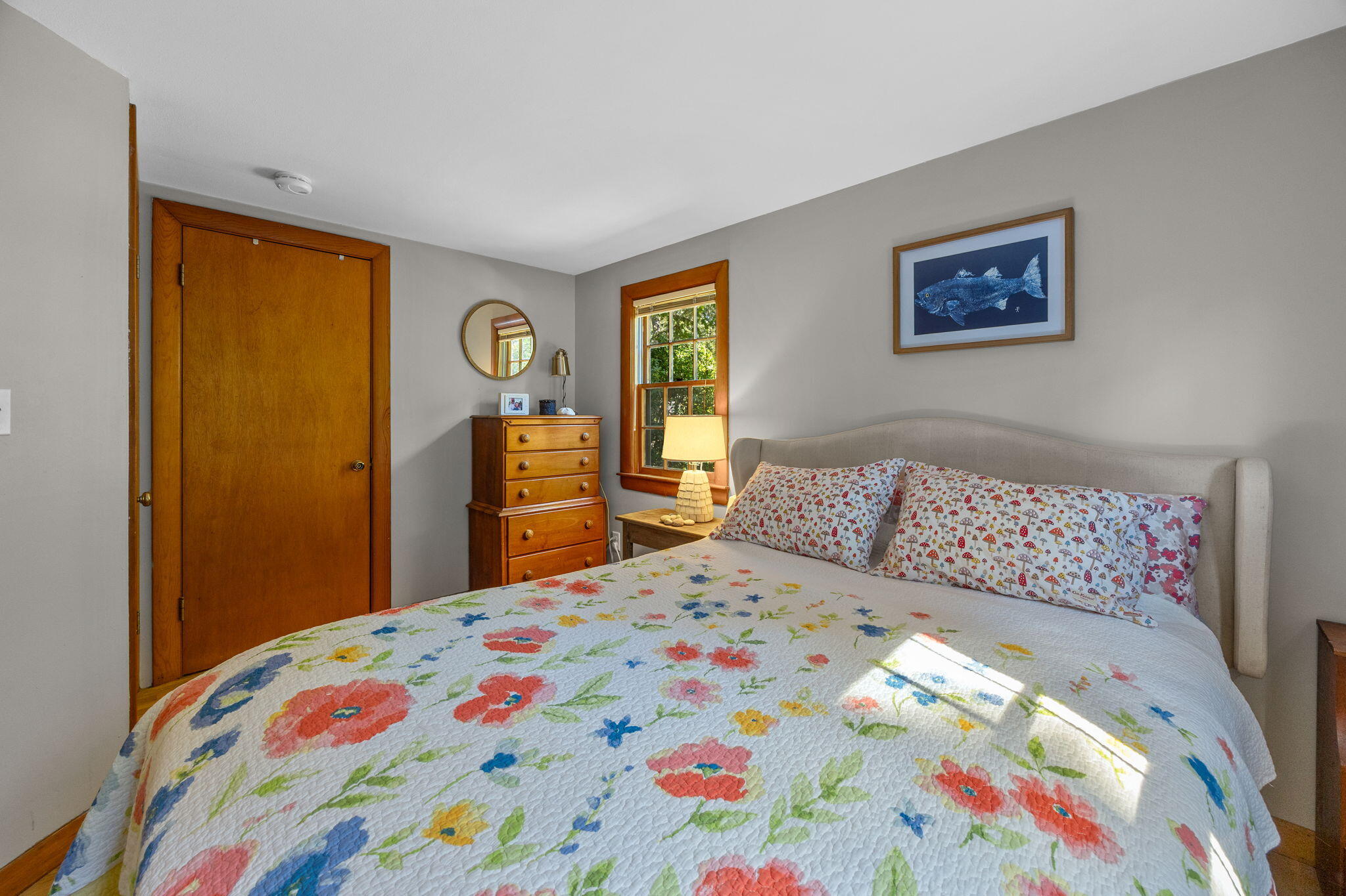 25 Robbins Road Harwich, MA 02646 - Photo 18 of 33 a bedroom with a bed and a lamp on dresser