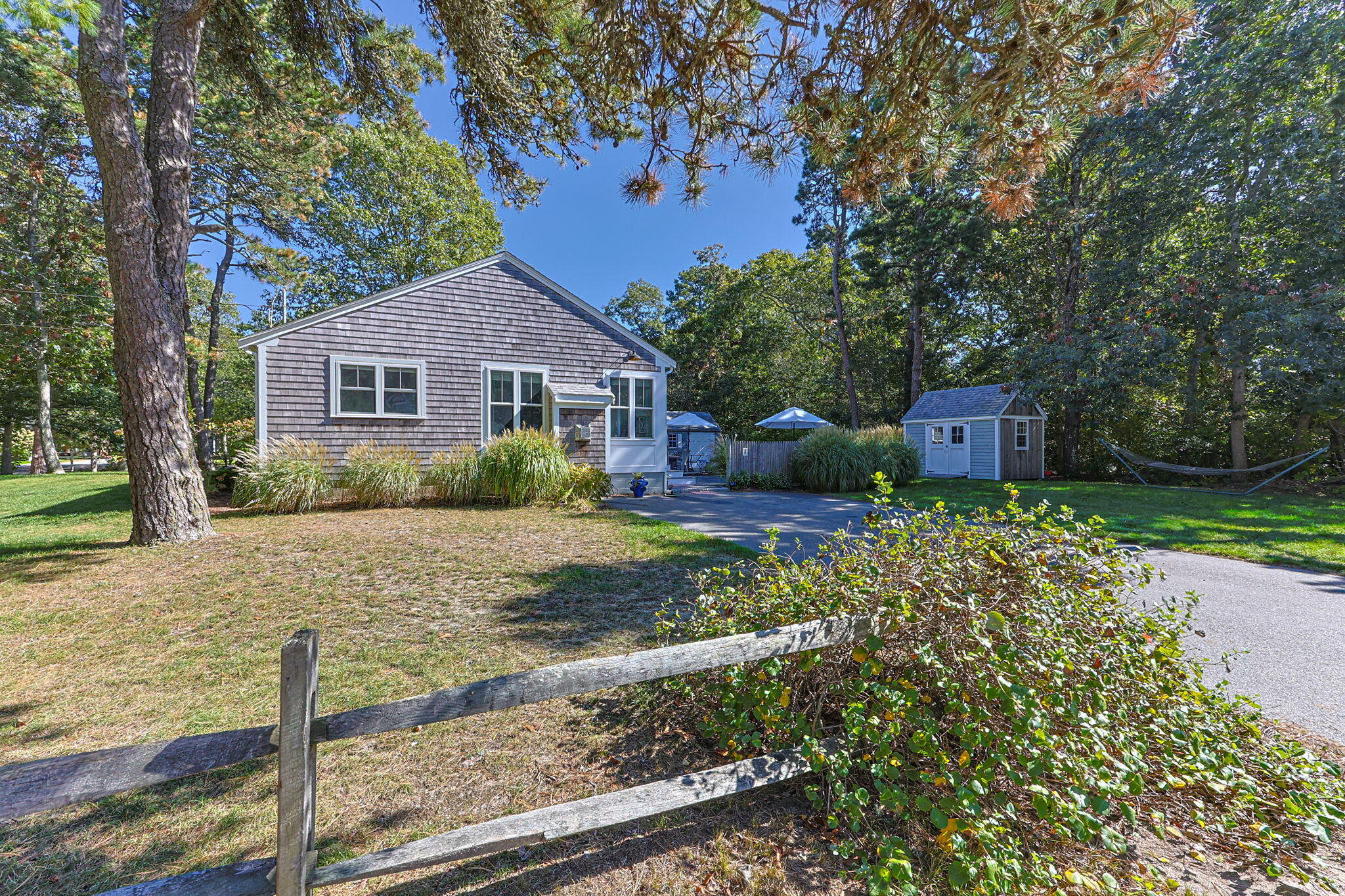 25 Robbins Road Harwich, MA 02646 - Photo 31 of 33 a front view of a house with garden