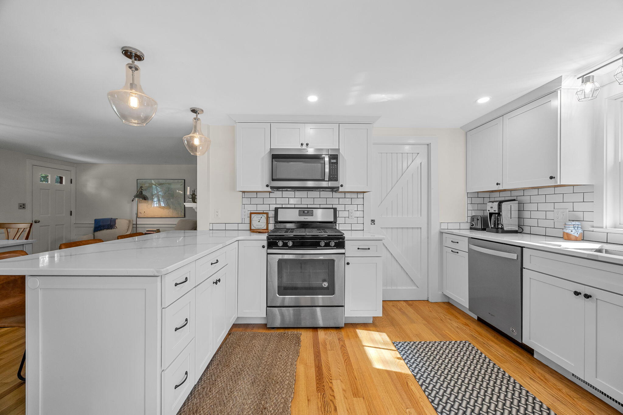 25 Robbins Road Harwich, MA 02646 - Photo 8 of 33 a kitchen with granite countertop a sink cabinets and stainless steel appliances