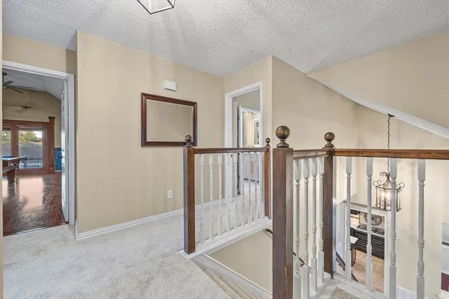 a view of staircase with rug floor