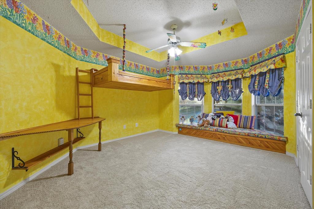 7410 Arborside Drive Rowlett, TX 75089 - Photo 26 of 39 Auxiliary bedroom includes spacious closet and loft.