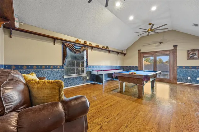a outdoor living room with furniture and a wooden floor