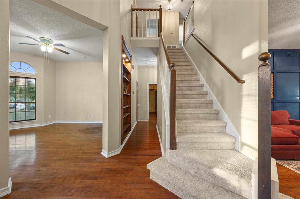 7410 Arborside Drive Rowlett, TX 75089 - Photo 7 of 39 Majestic staircase opens on to grand foyer