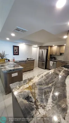 a bedroom with a bed and a view of bathroom