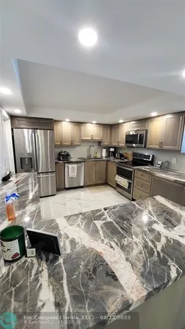 a bedroom with a bed and a lamp