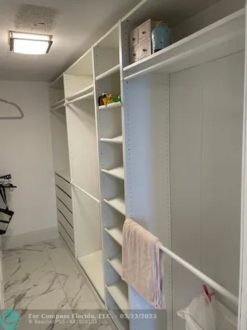 a room with a mirror and gym equipment