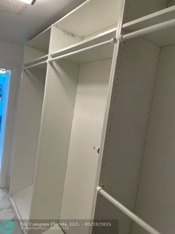 a view of outdoor space with signage and flags