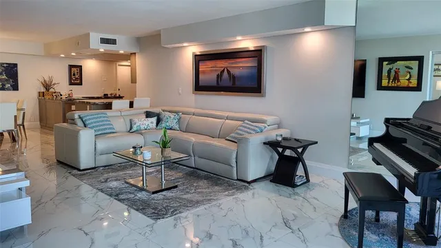 a kitchen with granite countertop a refrigerator and a stove