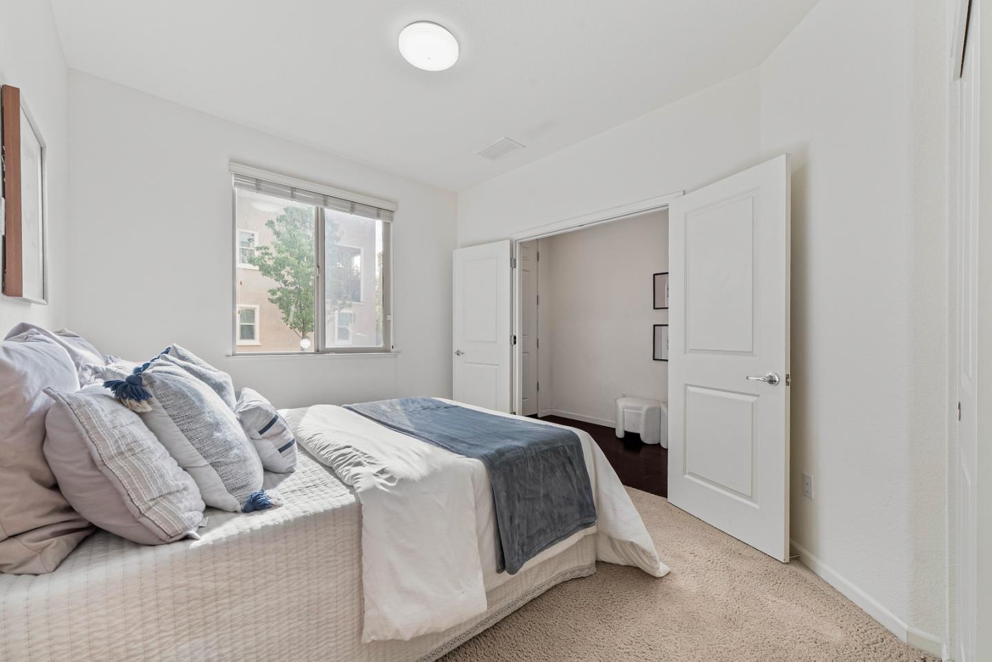 2753 Ferrara Circle San Jose, CA 95111 - Photo 15 of 46 a bedroom with a bed and window