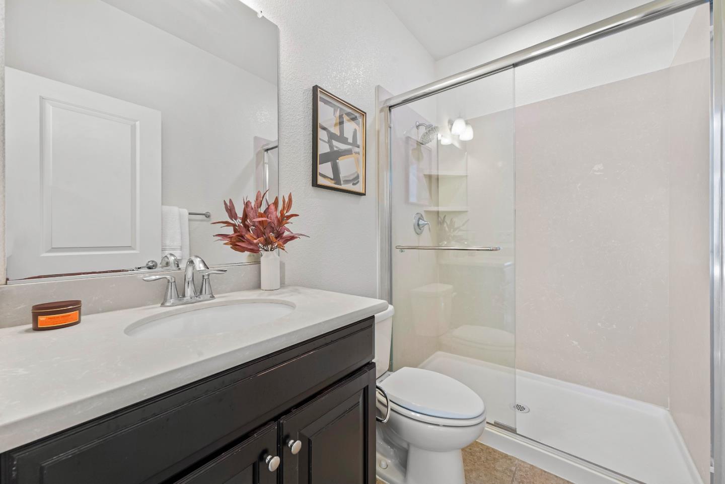 2753 Ferrara Circle San Jose, CA 95111 - Photo 16 of 46 a bathroom with a sink a toilet a shower and a mirror