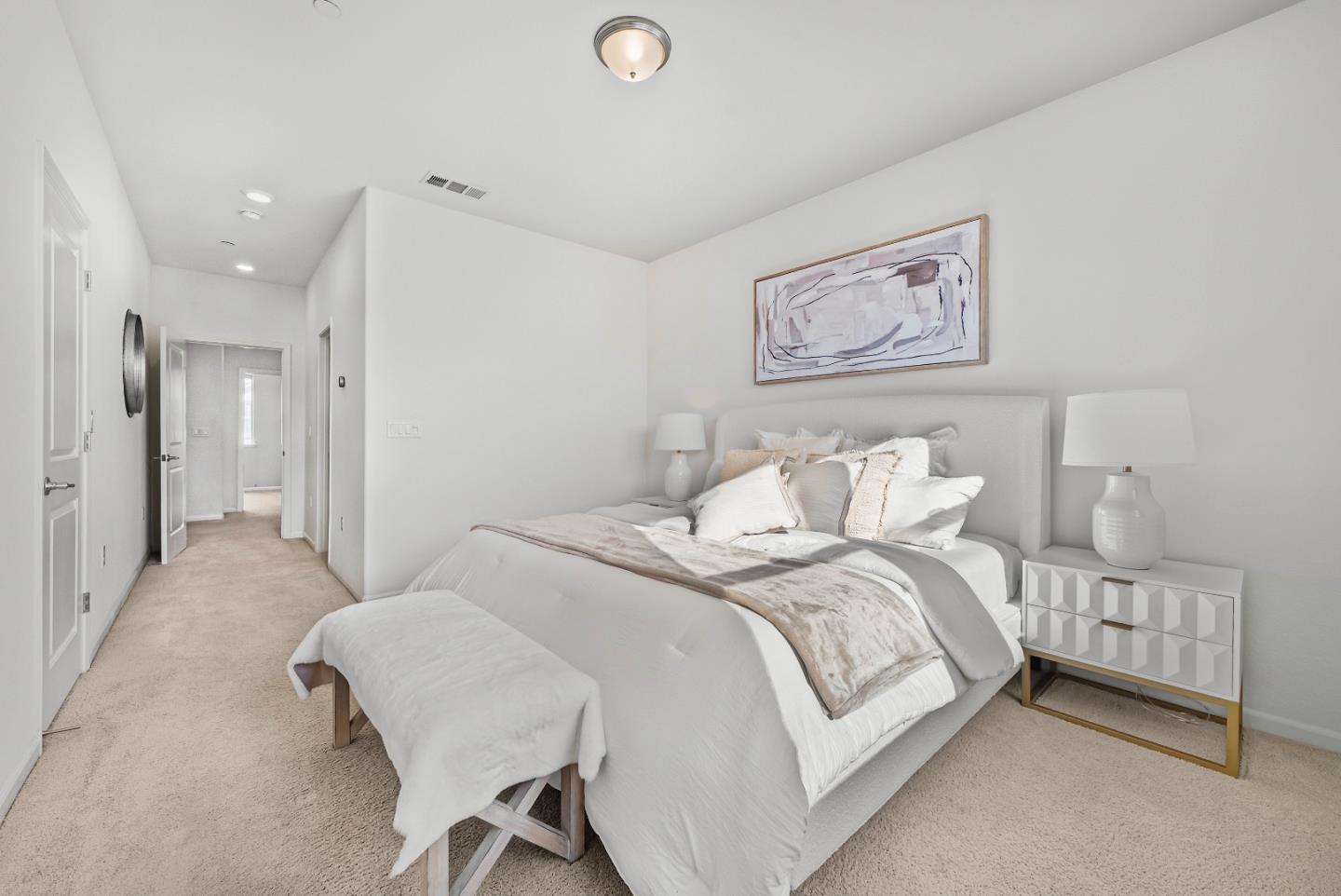 2753 Ferrara Circle San Jose, CA 95111 - Photo 24 of 46 a bedroom with a bed and a lamp