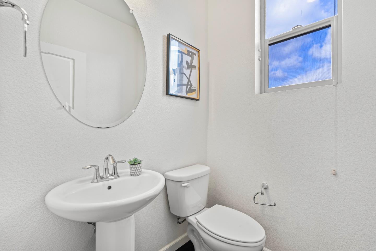 2753 Ferrara Circle San Jose, CA 95111 - Photo 27 of 46 a bathroom with a toilet a sink and a mirror