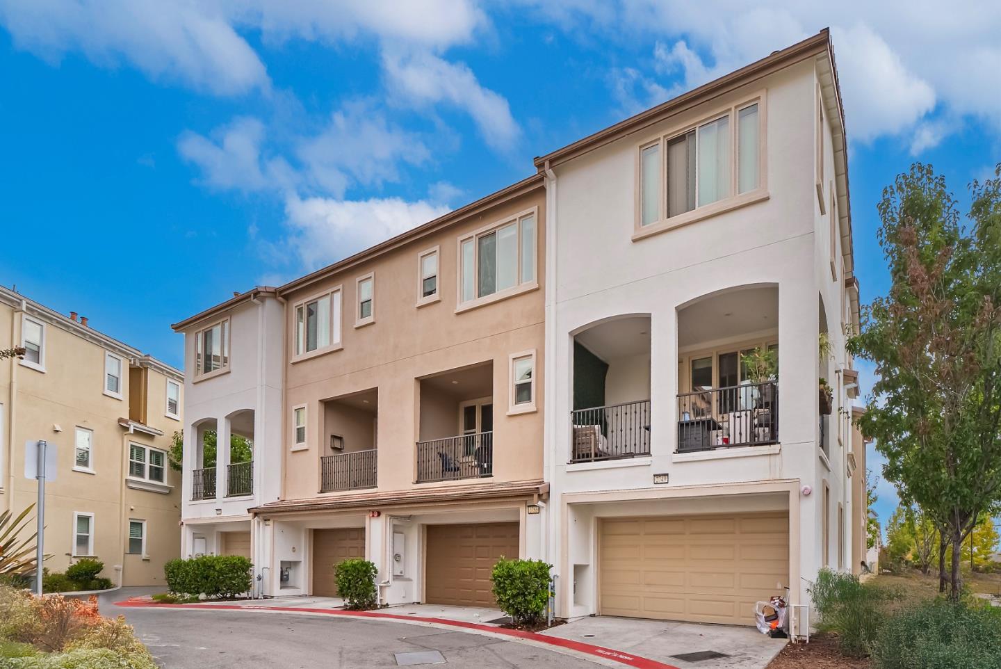 2753 Ferrara Circle San Jose, CA 95111 - Photo 32 of 46 a front view of a building with a lot of windows