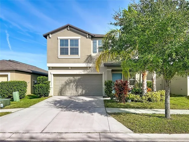 a large kitchen with stainless steel appliances lots of counter top space