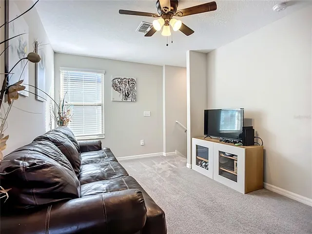a bathroom with a granite countertop sink a mirror a and a shower