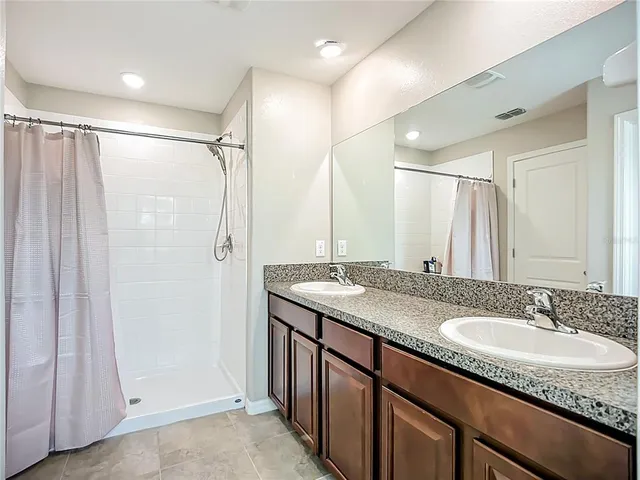 a bathroom with a bathtub and shower