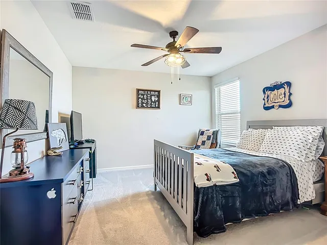 a bathroom with a granite countertop tub sink and mirror