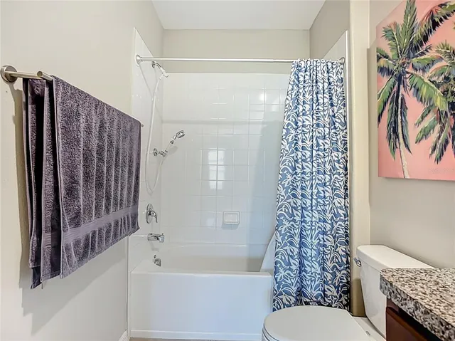 a bedroom with furniture and a baby crib