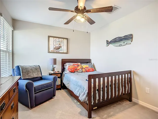 an aerial view of a house with swimming pool and ocean view